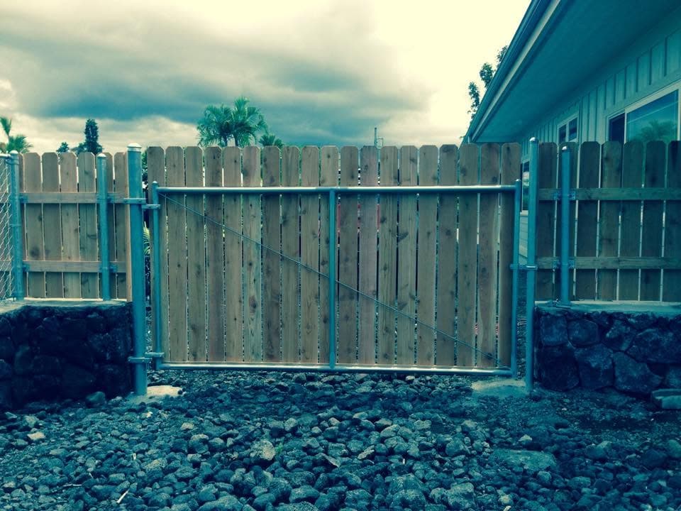 Wood dog-ear picket fence and gate — On The Line Fencing project, Big Island, Hawaii
